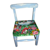 A small childs chair with a fairy theme