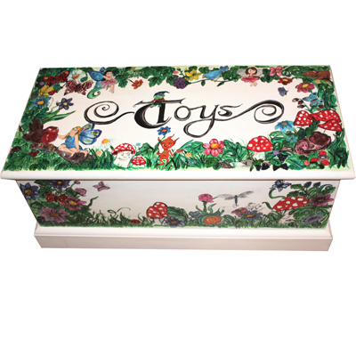 A large toybox painted with a woodland and fairy theme